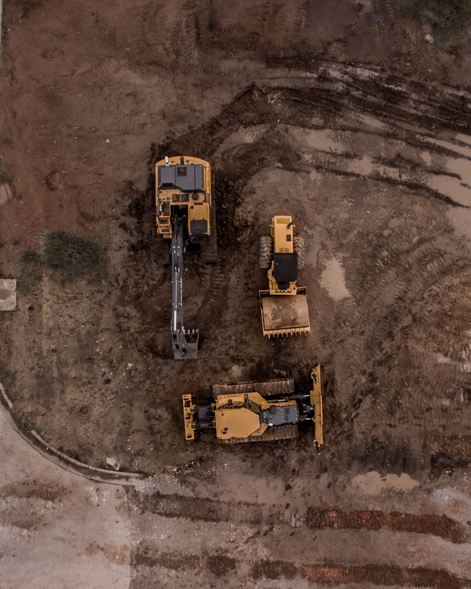 Aerial view of heavy equipment on a graded dirt site